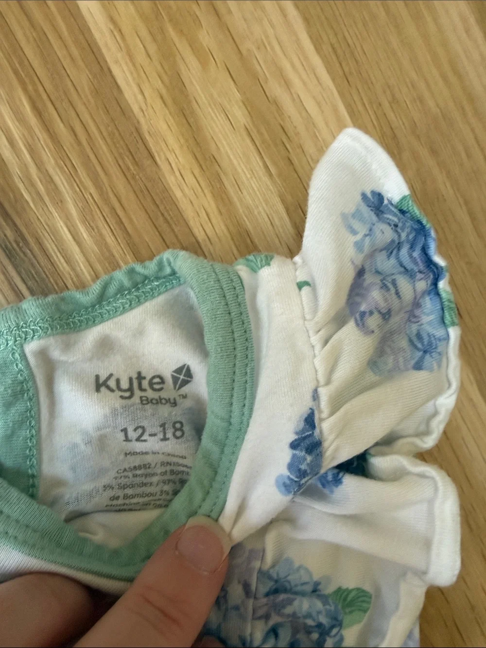 Kyte BABY White Romper with Blue Hydrangea Print and Mint Trim